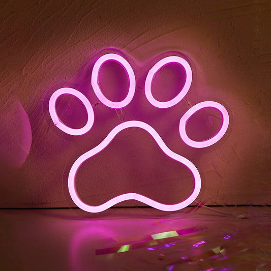Neon paw-shaped night light sign with vibrant glowing colors, ideal for room decor or night lighting.